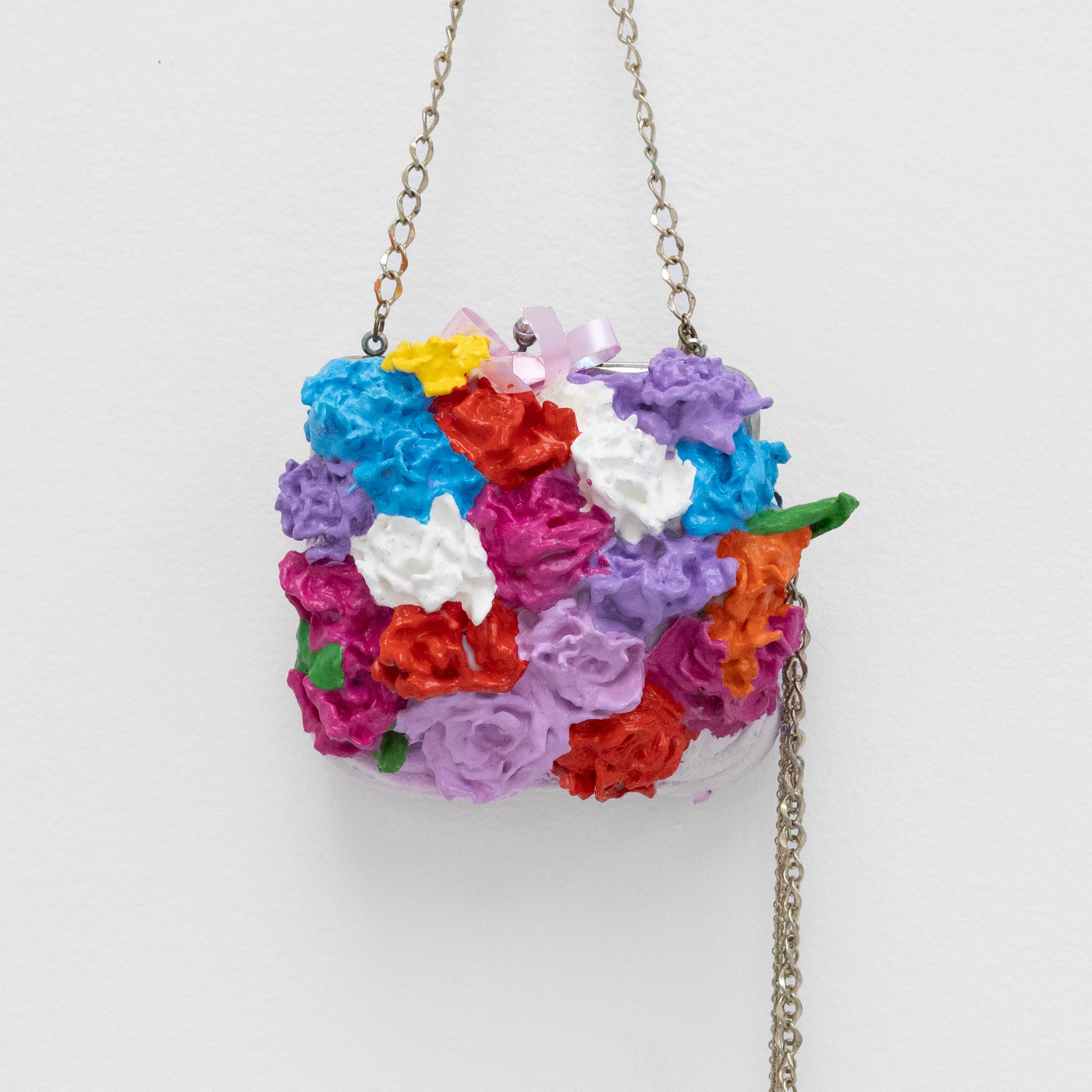 Colorful floral handbag with a chain strap 