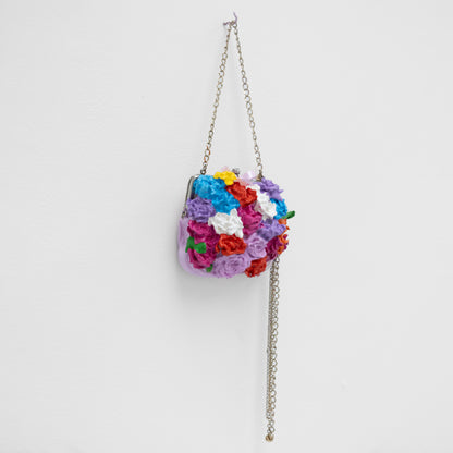 Colorful floral handbag with a chain strap 